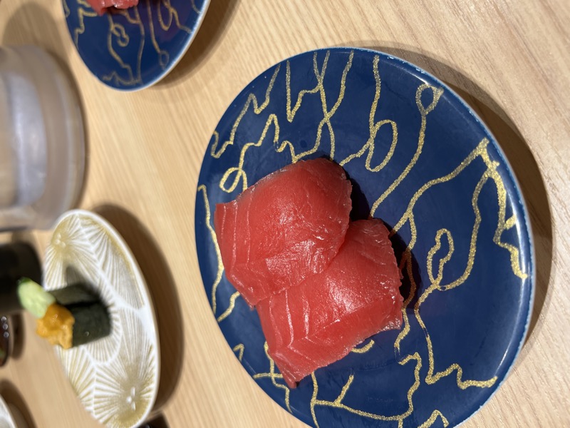 Tuna sashimi on blue and gold plate